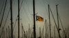 FILE - A Catalonia independence flag waves on a mast of a boat at the port of Vilanova i La Geltru, Spain, Oct. 31, 2017. 