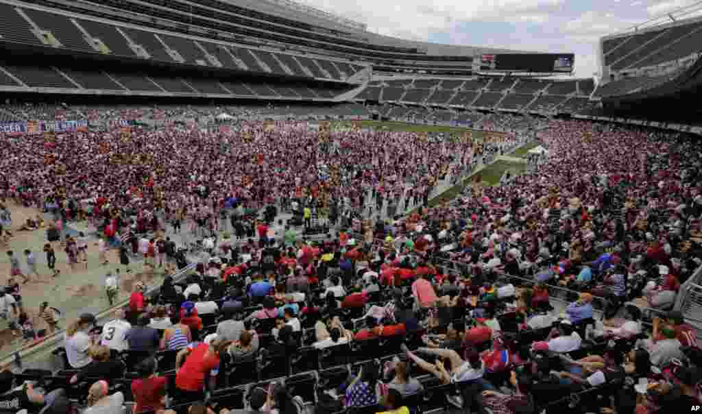 Fans cheer for the U.S. during a World Cup soccer game viewing party between U.S. and Belgium at Solider Field in Chicago, July 1, 2014.