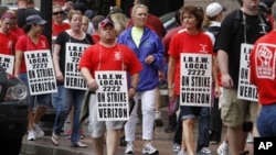 Verizon workers picket outside of the company's New England headquarters in Boston, Sunday, Aug. 7, 2011. Forty-five thousand Verizon Communications Inc. workers from Massachusetts to Washington, D.C., went on strike Sunday after negotiations fizzled ove