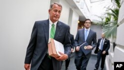 House Speaker John Boehner walks to a closed-door meeting with House Republicans on Capitol Hill, Jan. 7, 2015.