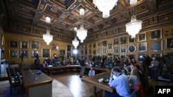 Journalists wait for the announcement of the winners of the 2023 Nobel Prize in Physics at Royal Swedish Academy of Sciences in Stockholm on Oct. 3, 2023. 
