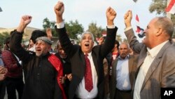 Protesters shout slogans against the Turkish government during a demonstration calling for the withdrawal of Turkish troops from northern Iraq, in Basra, Iraq, Dec. 18, 2015.