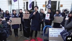 FILE - Hong Kong activist Tony Chung takes part in a protest against Hong Kong's Basic Law Article 23, in London, March 23, 2024.