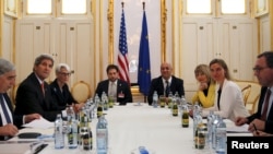 FILE - U.S. Secretary of Energy Ernest Moniz, U.S. Secretary of State John Kerry and U.S. Under Secretary for Political Affairs Wendy Sherman (L-3rd L) meet with European Union foreign policy chief Federica Mogherini (2nd R) at a hotel in Vienna, Austria, June 28, 2015, as the deadline for a nuclear deal with Iran approaches.