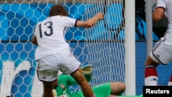 Germany's Thomas Mueller kicks to score his team's fourth goal, his third in the match, past Portugal's Rui Patricio during their 2014 World Cup Group G soccer match at the Fonte Nova arena in Salvador, June 16, 2014.