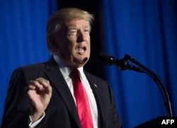 US President Donald Trump speaks to staff at the Department of Homeland Security in Washington, DC, on Jan. 25, 2017.