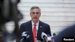 FILE - Georgia Secretary of State Brad Raffensperger gives a news conference in Atlanta, Georgia, Nov. 6, 2020. 