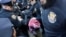 A demonstrator is detained by police officers during a protest following the arrest by U.S. immigration agents of Palestinian student protester Mahmoud Khalil at Columbia University in New York City, March 10, 2025. 