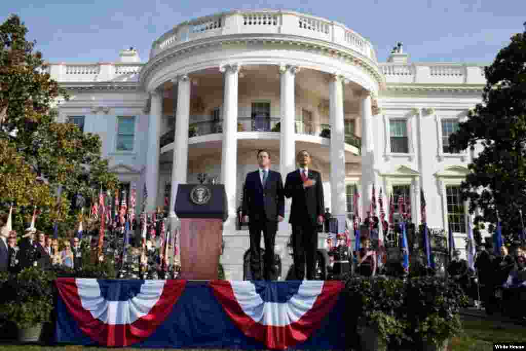 President Barack Obama and Prime Minister David Cameron of the United Kingdom stand during the playing of the national anthem during the Official Arrival Ceremony on the South Lawn, March 14, 2012. (White House/Pete Souza)