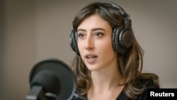 FILE - Journalist Cecilia Sala, arrested by police in Tehran on Dec. 9, 2024, according to Italy's foreign ministry, records a podcast at her Rome home in this undated photo. She was released Jan. 8, 2025, and returned home, Italian officials said. (Chora Media via Reuters)