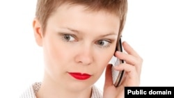 Woman using a modern “smartphone” (Public Domain via Pixabay)