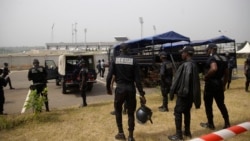 Police officers patrol the entrance of Bafoussam stadium ahead of a group B soccer match between Senegal and Guinea at the African Cup of Nations 2022, in Bafoussam, Cameroon, Jan. 14, 2022.