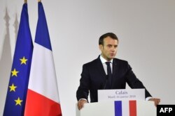 French President Emmanuel Macron gives a speech in the northern port of Calais on Jan. 16, 2018, vowing that France will not allow another migrant camp like the infamous "Jungle" to spring up in the city.