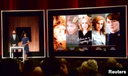 Actor John Krasinski (L) and Academy of Motion Picture Arts and Sciences President Cheryl Boone Isaacs announce the nominees for the Best Actress in a Supporting Role during the nominations announcements for the 88th Academy Awards in Beverly Hills, California, Jan. 14, 2016.