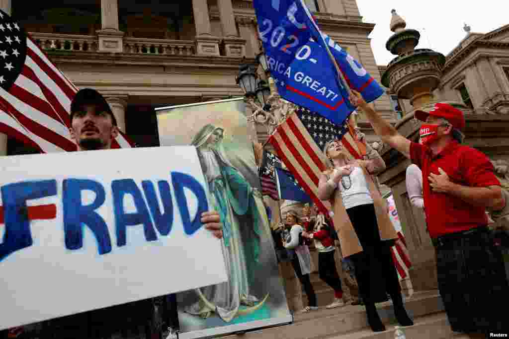 Protesters rally outside the State Capitol building after former Vice President Joe Biden was declared the winner of the 2020 U.S. presidential election, in Lansing, Michigan, Nov. 8, 2020.