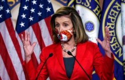 FILE - Speaker of the House Nancy Pelosi, D-Calif., talks to reporters at the Capitol in Washington, Nov. 6, 2020.