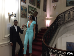 Model wears sexy jumpsuit from designer Prajje Oscar's "Ezili" collection at the Haitian Embassy's "Fashion By Design" event in Washington, D.C. Feb. 23, 2018. (VOA / S. Lemaire)