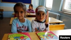 FILE - Syrian refugee children study at Fatih Sultan Mehmet School in Ankara, Turkey, Sept. 28, 2015. A new UNICEF appeal aims to assist youngsters, including in getting education. 