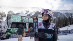 Eileen Gu, of China, looks toward the crowd following the halfpipe finals, Dec. 17, 2021, during the Dew Tour freestyle skiing event at Copper Mountain, Colo.