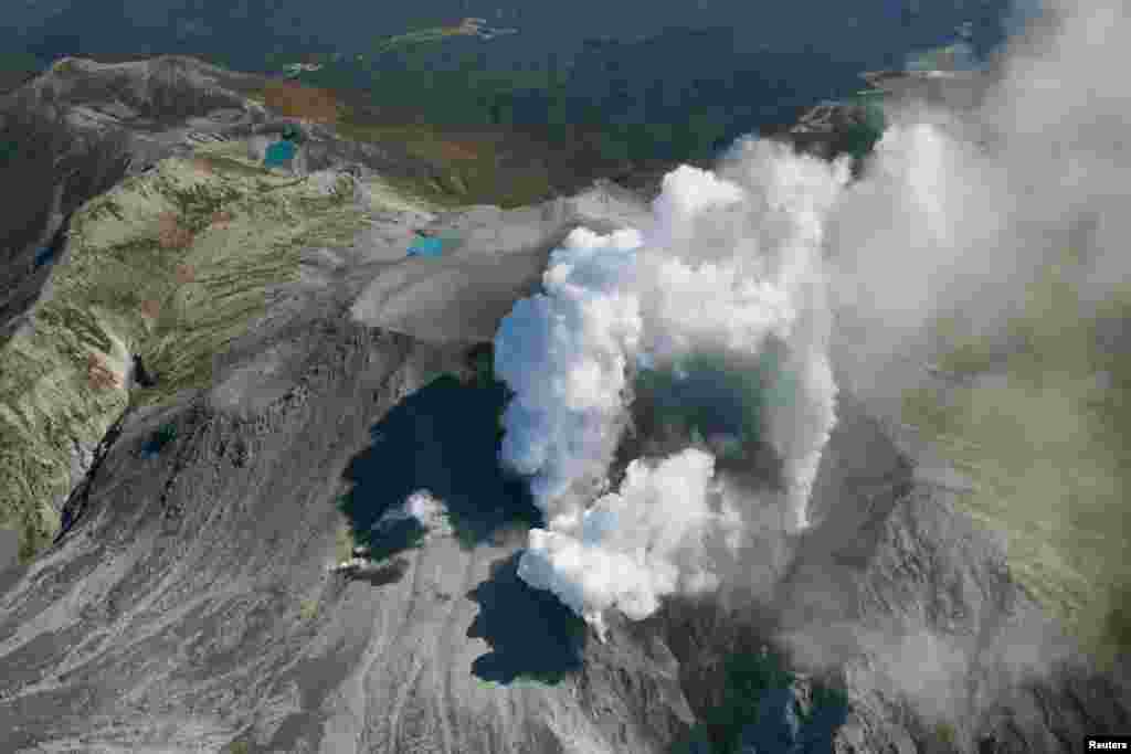 Volcanic smoke rises from Mount Ontake, which straddles Nagano and Gifu prefectures, central Japan, Sept. 29, 2014. 