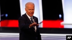 Former Vice President Joe Biden waves after the second of two Democratic presidential primary debates hosted by CNN, July 31, 2019, in the Fox Theatre in Detroit. 