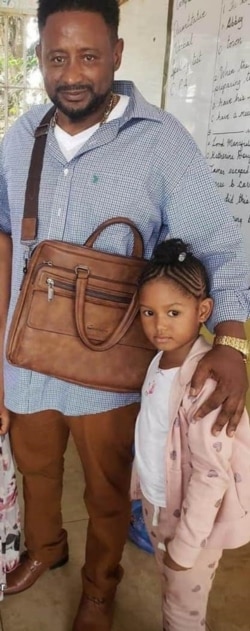 Kadijah Saccoh, who was raped and killed in June, allegedly by a family member in Sierra Leone, is seen with her father, Abubakarr Saccoh, in this photo taken from his Facebook account.