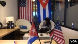 The office of Cuba Inspires is draped with U.S. and Cuban national flags. (J. Soh/VOA)