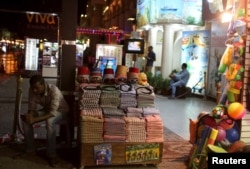 A vendor, front, awaits customers for an excursion trip at the Red Sea resort of Sharm el-Sheikh, Nov. 8, 2015.