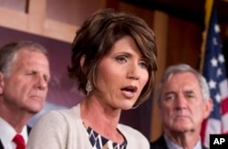 FILE - Rep. Kristi Noem, R-S.D., speaks to reporters on Capitol Hill, Washington, Aug. 1, 2013.