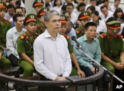 Nguyen Xuan Son, former general director of Ocean Bank, appears in a court in Hanoi, Vietnam, Monday, Aug. 28, 2017. Son and 50 bankers and business executives were put on trial Monday for alleged graft and mismanagement causing $69 million in losses to the bank.