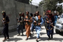 Taliban fighters patrol in the Wazir Akbar Khan neighborhood in Afghanistan's capital of Kabul, Aug. 18, 2021.