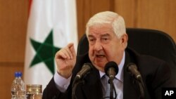 FILE - Syrian Foreign Minister Walid al-Moallem.