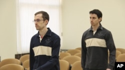 American hikers Shane Bauer (L) and Josh Fattal attend the first session of their trial at the revolutionary court in Tehran, Iran February 6, 2011.