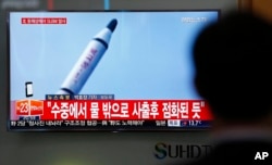 A man watches a TV news program showing a file footage of a missile launch conducted by North Korea, at the Seoul Train Station in Seoul, South Korea, April 23, 2016.