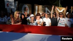 People are seen gathered during an anti-government protest in support of a free judiciary in front of the Senate building in Warsaw, Poland, July 24, 2018.
