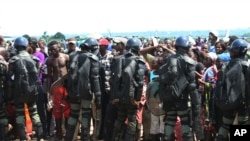 FILE - Displaced residents fleeing sectarian violence were cordoned off by military at the airport at Bangui, Central African Republic in late August when the airport was temporarily shut down. 