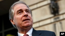 Chairman of the National Legal and Policy Center, Peter Flaherty, speaks to media as he leaves federal court in Washington, Nov. 8, 2018.