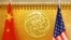 FILE - Chinese and U.S. flags are set up for a meeting at China's Ministry of Transport in Beijing, April 27, 2018. 