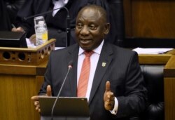 FILE - President Cyril Ramaphosa delivers his State of the Nation address at parliament in Cape Town, South Africa, Feb. 13, 2020.