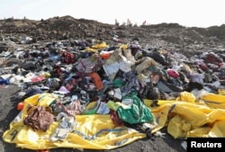 Clothing and personal effects from passengers are seen near the wreckage at the scene of the Ethiopian Airlines Flight ET 302 plane crash, near the town of Bishoftu, southeast of Addis Ababa, March 11, 2019.