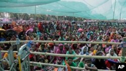 Supporters of Trinamool Congress party attend an election rally addressed by party leader and Chief Minister of West Bengal state Mamata Banerjee, at Anchana in Mathurapur, about 60 kilometers south of Kolkata, India, May 16, 2019.