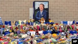 Tributes from supporters are seen outside Leicester City Football Club after a helicopter crashed Saturday killing Leicester City's owner, Thai billionaire Vichai Srivaddhanaprabha, and four other people, in Leicester, England, Monday Oct. 29 2018. 