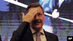 Melih Gokcek, Mayor of Ankara gestures as he announces his resignation, in Ankara, Turkey, Saturday, Oct. 28, 2017. 