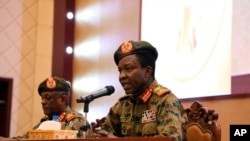 Sudan's ruling Military Council spokesperson Shamseddine Kabbashi makes a speech as he holds a press conference at the Presidential Palace in Khartoum, Sudan, Thursday, June 13, 2019.