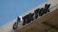 The TikTok logo is seen on the TikTok building in Culver City, California, on March 11, 2024. The U.S. House of Representatives is moving ahead with a bill that would require Chinese company ByteDance to sell TikTok or face a ban in the United States.