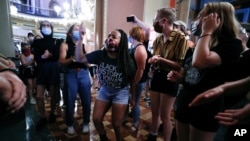 Black Lives Matter protesters rally outside Iowa Gov. Kim Reynolds' office, Monday, June 29, 2020, in Des Moines, Iowa. (AP Photo/Charlie Neibergall)