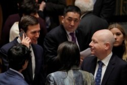 White House senior adviser Jared Kushner, left, speaks with U.S. Ambassador to the United Nations Jason Greenblatt before a meeting of the Security Council in New York, Feb. 20, 2018.