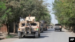 Afghan security forces arrive during a fight against Taliban fighters in Kunduz province north of Kabul, Afghanistan, Aug. 31, 2019. The Taliban have launched a new large-scale attack on one of Afghanistan's main cities, Kunduz.