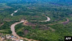 FILE - Aerial view of La Penita indigenous village, Darien province, Panama, May 23, 2019. Migrants cross the border between Colombia and Panama through the Darien Gap on their way to the United States.