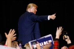 President Donald Trump gives a thumbs-up as he walks offstage after speaking at a campaign rally, Feb. 21, 2020, in Las Vegas.